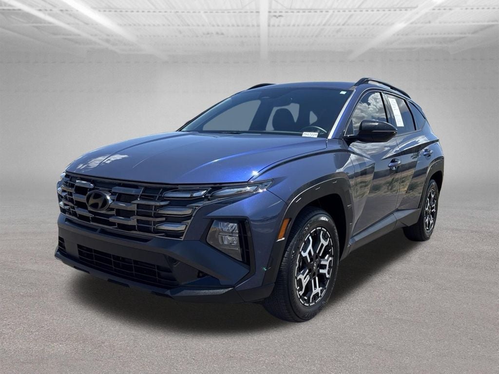 2025 Hyundai TUCSON XRT in Atlantis Blue — front three-quarter view